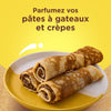 Une assiette de crAapes roulACes garnies d'une pActe A? tartiner au chocolat, suggACrant une faA?on de parfumer les pActes A? gActeaux et A? crAapes.