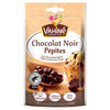 Un sachet de Vahiné Chocolat Noir Pépites illustré avec une cuillère en bois remplie de pépites de chocolat noir et un muffin.