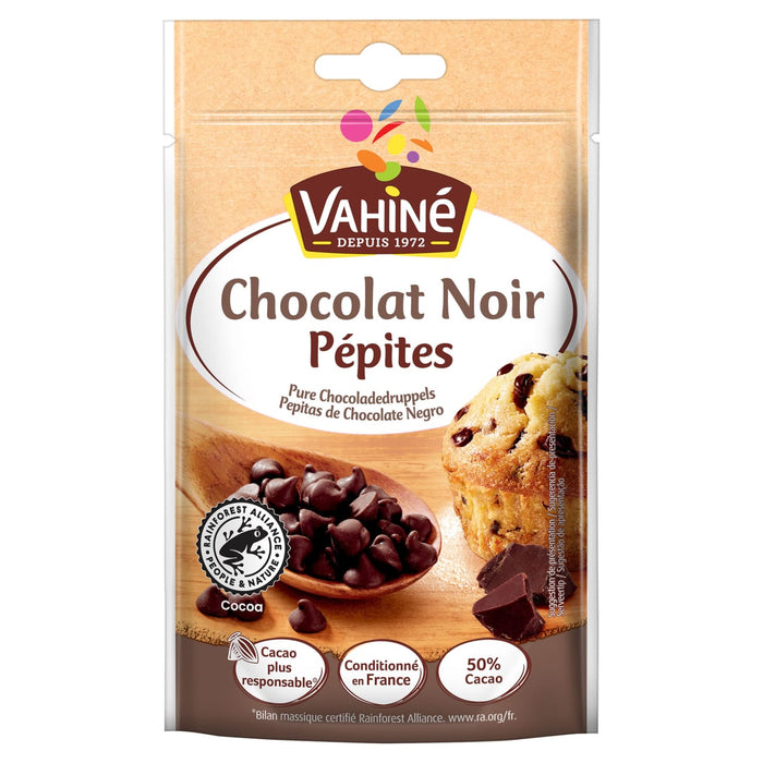 Un sachet de Vahiné Chocolat Noir Pépites illustré avec une cuillère en bois remplie de pépites de chocolat noir et un muffin.