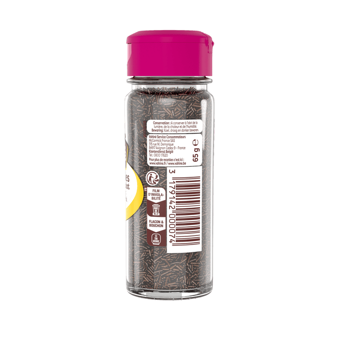 Une bouteille de poivre noir moulu Schwartz avec un couvercle rose.