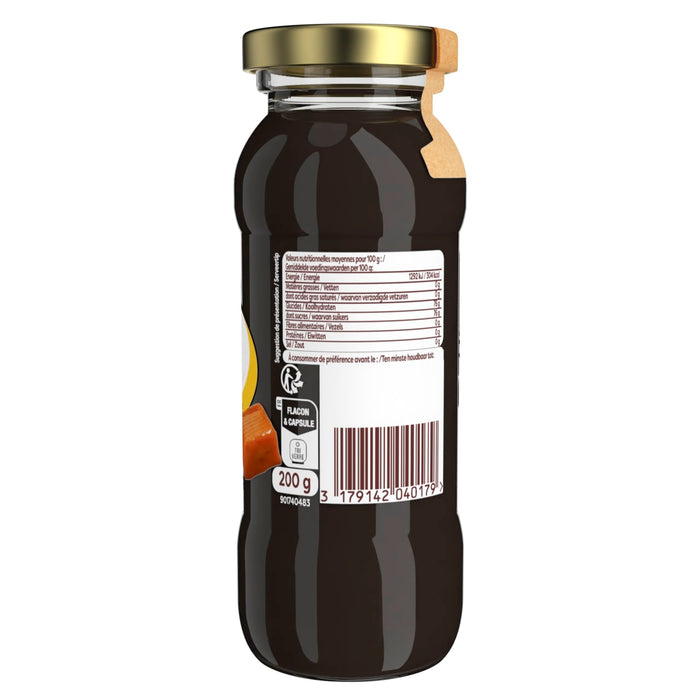 Une bouteille de ce qui semble Aatre une boisson foncACe, possiblement du jus ou du sirop, avec une ACtiquette nutritionnelle et un code-barres visibles.