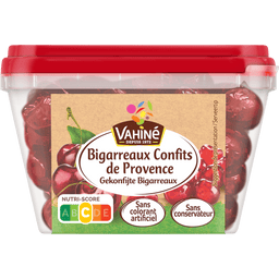 Un récipient de cerises confites de la marque Wauquier, étiquetées Bigarreaux Confits de Provence.