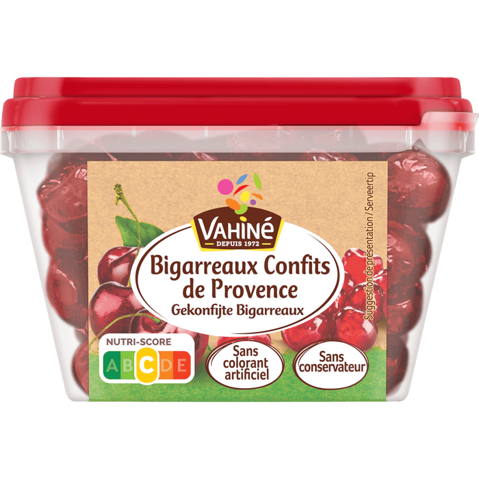 Un récipient de cerises confites de la marque Wauquier, étiquetées Bigarreaux Confits de Provence.