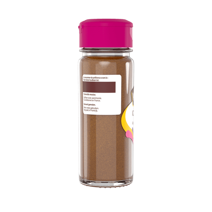Une bouteille de poudre de muscade McCormick avec un couvercle rose.