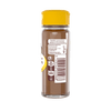 Une bouteille de poudre chocolatACe Nesquik de NestlAC avec un couvercle jaune prACsente les informations nutritionnelles et le code-barres sur son ACtiquette.