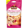 Un paquet de Vahiné Mix Gourmand pour la pâtisserie contenant des pépites de chocolat blanc, des cranberries et des morceaux de caramel au beurre salé, idéal pour faire des muffins.