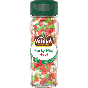 Un récipient de décorations Vahiné Party Mix Noël, avec des formes festives rouges, vertes et blanches.