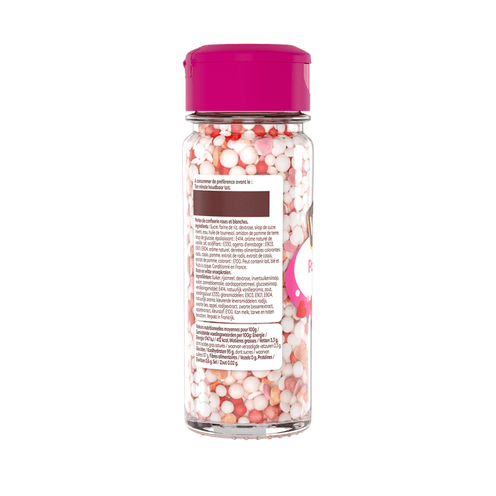Une bouteille de vermicelles de dACcoration avec un couvercle rose, probablement utilisACe pour dACcorer des desserts.