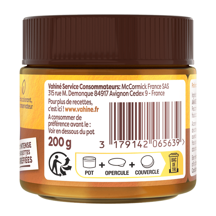 Le dos d'un pot de confitures St. Dalfour montrant les informations sur le produit, le code-barres et les symboles de recyclage.