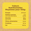 Une étiquette jaune d'informations nutritionnelles, faisant partie des Vahine Nutritional Ingredients And Hero Recipe Images, détaille les valeurs nutritionnelles moyennes pour 100 g en français sur un fond texturé de carton.