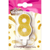 Une bougie d'anniversaire de la marque Valhús en forme de chiffre huit, recouverte de paillettes dorées.