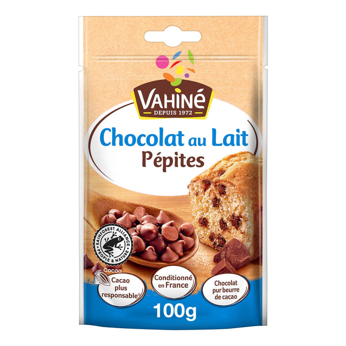Un emballage Vahiné de Vahine Sch Pepites Chocolaitx10-Va, présentant des pépites de chocolat au lait dans une cuillère en bois et incorporées dans un gâteau, avec le texte indiquant Chocolat au Lait Pépites, Fabriqué en France et 100g.