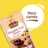 Un paquet de pépites de chocolat noir Vahiné, annoncées comme maxi carrés, est présenté sur un fond jaune.