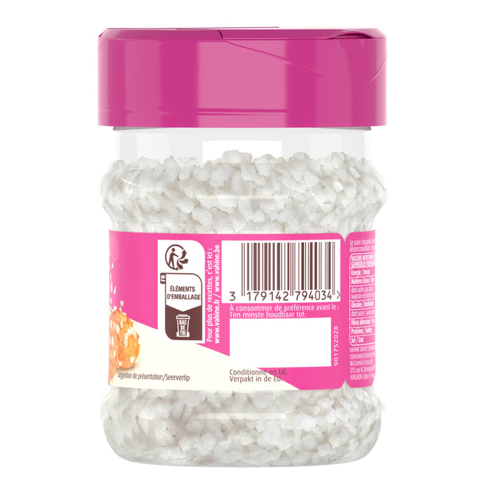 Un rACcipient de perles argentACes Dr. Oetker avec un couvercle rose.