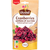 Un paquet de canneberges séchées et sucrées de la marque Vahiné est présenté.